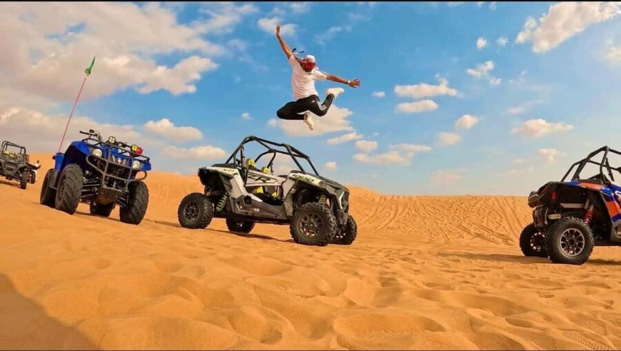Desert Safari, QuadBike,Dune buggy, Sandboarding & CamelRide - Desert dunes meet the Inland Sea in Qatar