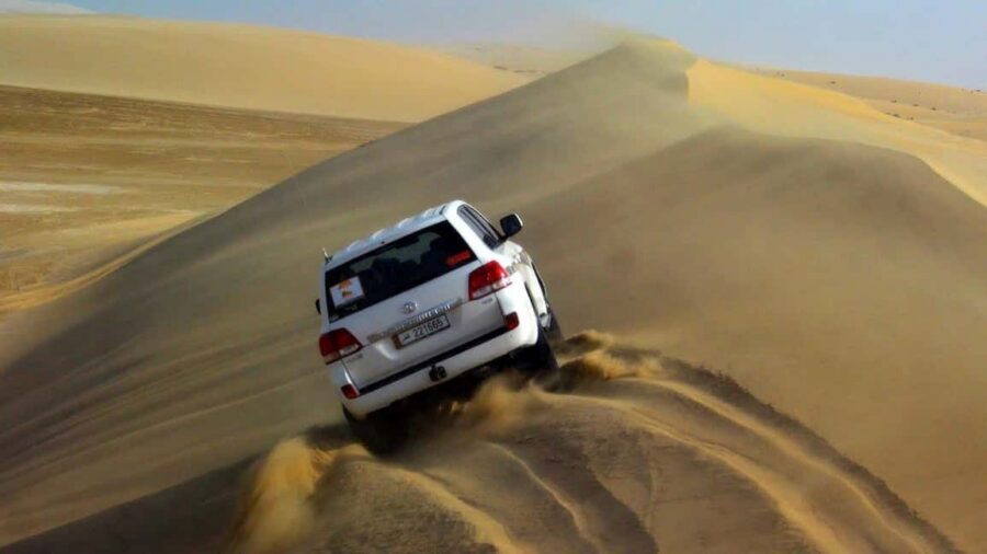 Desert Safari, QuadBike,Dune buggy, Sandboarding & CamelRide - Quad bike ride and camel stop: the photo-and-pace mix