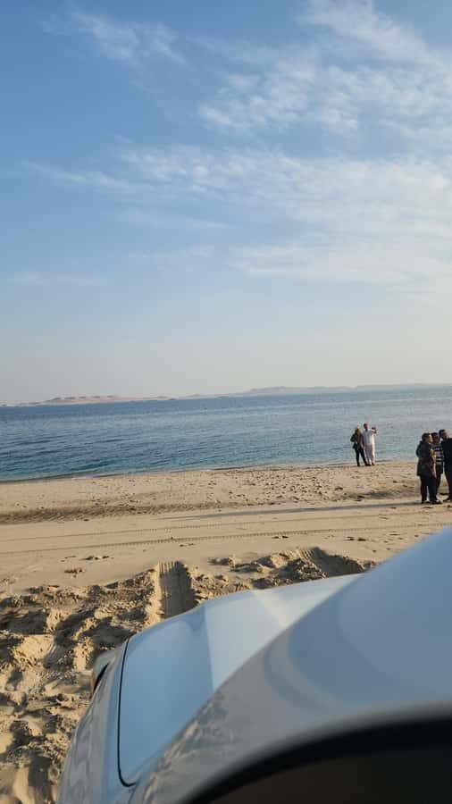 Doha: inland sea Tour With Dune Bashing &Sandboarding fun - Sandboarding on golden dunes: fast, physical, and oddly satisfying