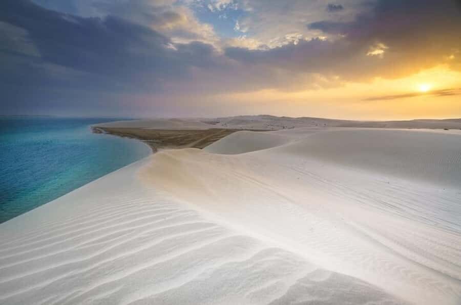 Doha: Sunset Desert Safari with Camel Ride & Sandboarding - Camel ride in the desert: quick, calm, and culturally meaningful