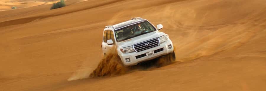 Doha: Thrilling 4x4 Desert Safari, Inland Sea-All Activities - Photo stop with a camel: quick, fun, and very practical