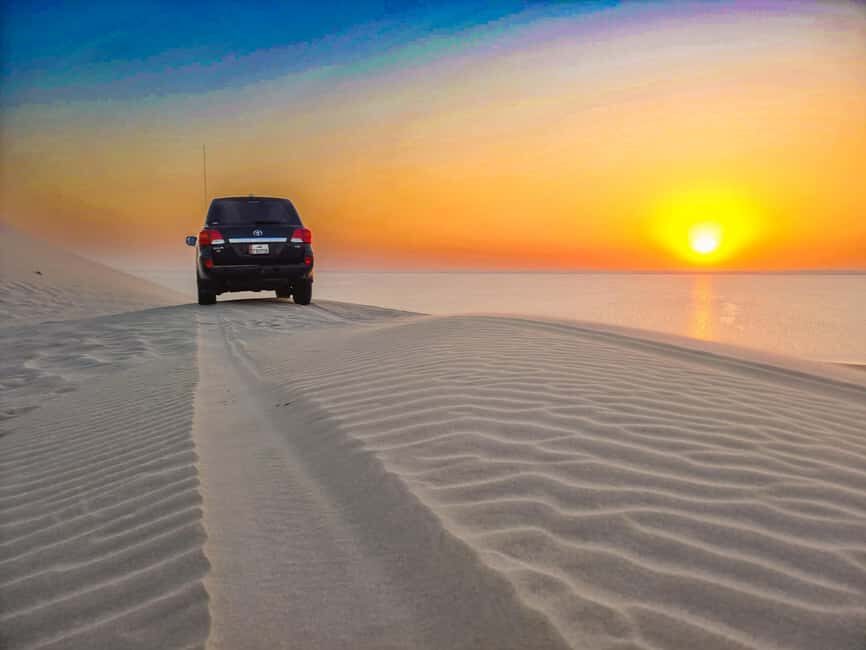 Doha:Quad Bike Desert Safari Adventure with 4x4 Vehicle Ride - Sandy Peak Views: Where the Sea Horizon Meets Sky