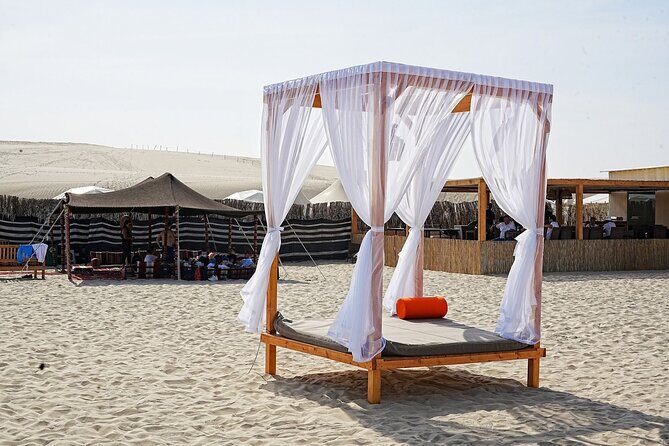 Private Full Day Desert Safari Dinner and Camel Ride in Doha - Dune bashing, sandboarding, and that top-of-dune photo stop