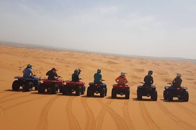 Qatar ATV And Quad Bike Experience With Sand Boarding - ATV riding across red-sand dunes: what it feels like and how to enjoy it