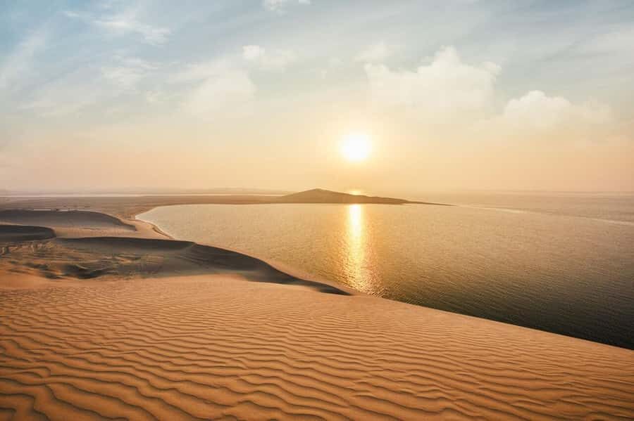 Qatar: Sunset Desert Safari with Camel Ride & Sandboarding - Inland Sea sunset stop: the view that makes the timing click