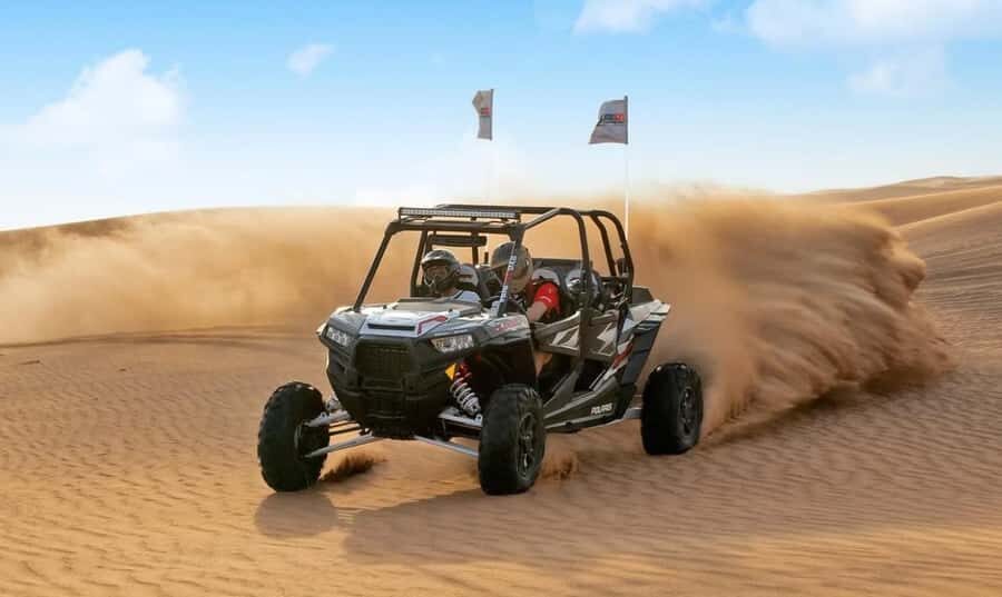 Qatar: Sunset Desert Safari with Camel Ride & Sandboarding - Dune bashing in a 4x4: fun, fast, and worth respecting
